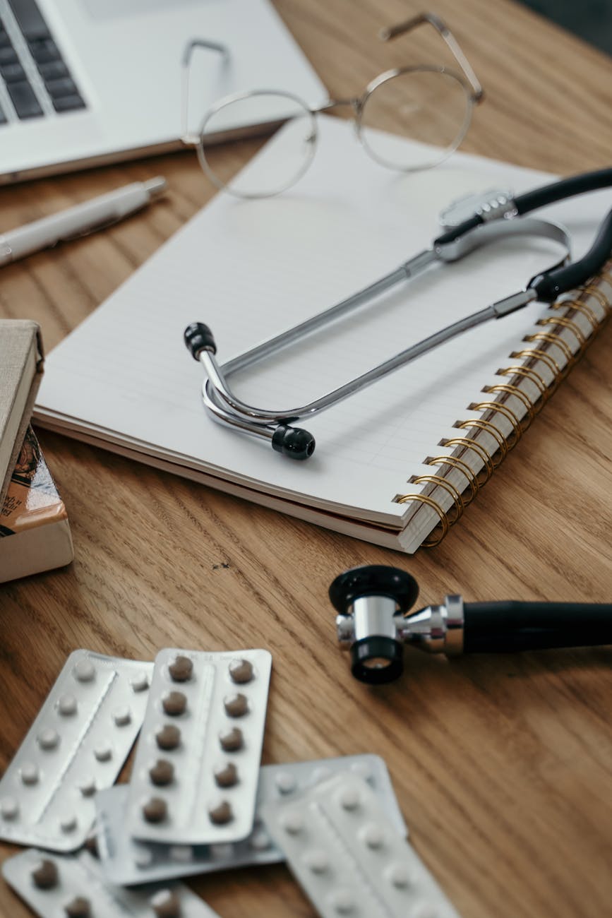 stethoscope and notebook on desk